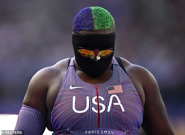 Raven Saunders has captivated fans with a unique look - a black mask, shades, and vibrant green and purple hair