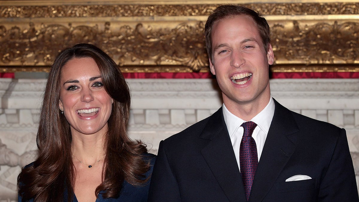 Prince William and Kate Middleton beaming after their engagement announcement.