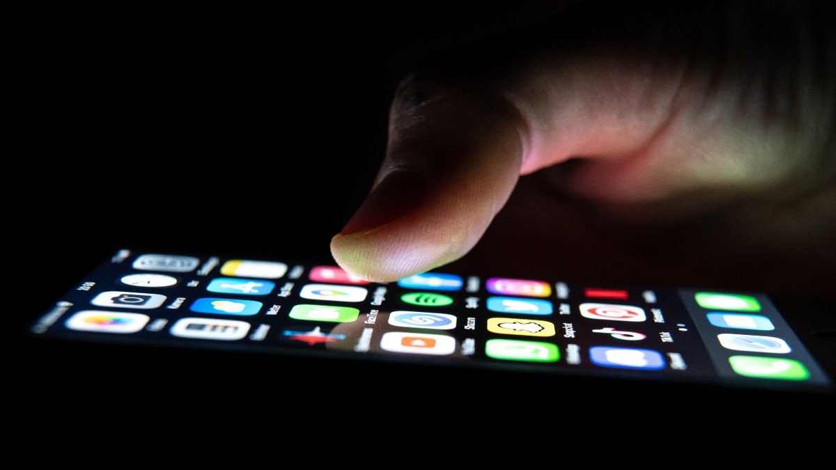 A person holding an iPhone
