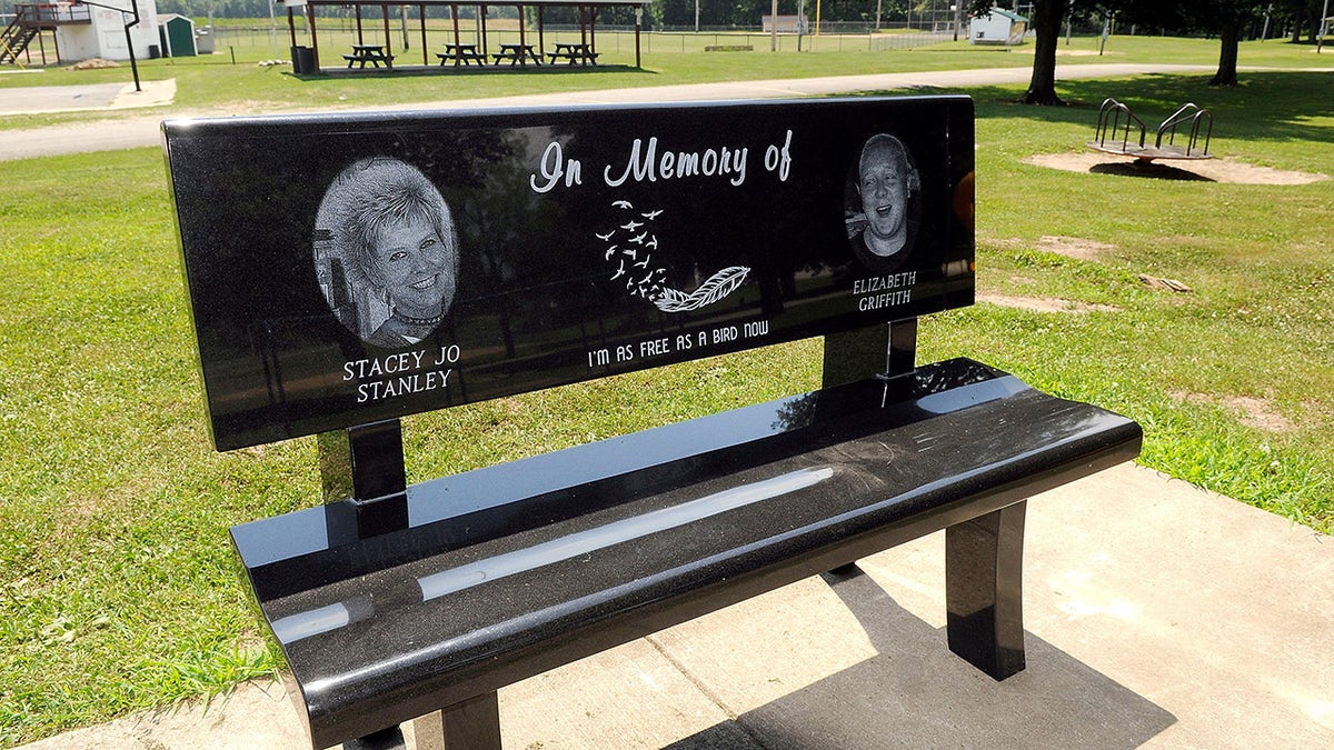 A black bench honoring two of Shawn Grate's victims.