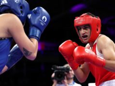 Olympic boxer who failed gender test wins quarterfinal bout, guaranteed medal