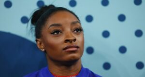 Simone Biles takes nasty slip in warmup minutes before Olympics floor routine – after earlier slipping off the beam and failing to win a medal