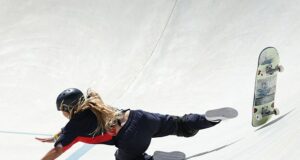 Sky Brown clutches onto her shoulder which she dislocated just over a week ago after she FALLS off her skateboard during preliminary round ahead of today’s final