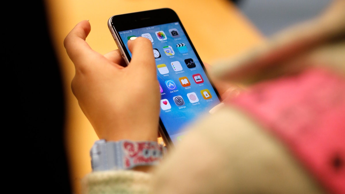 A child with an iPhone in an Apple store on Sept. 25, 2015 in Chicago.