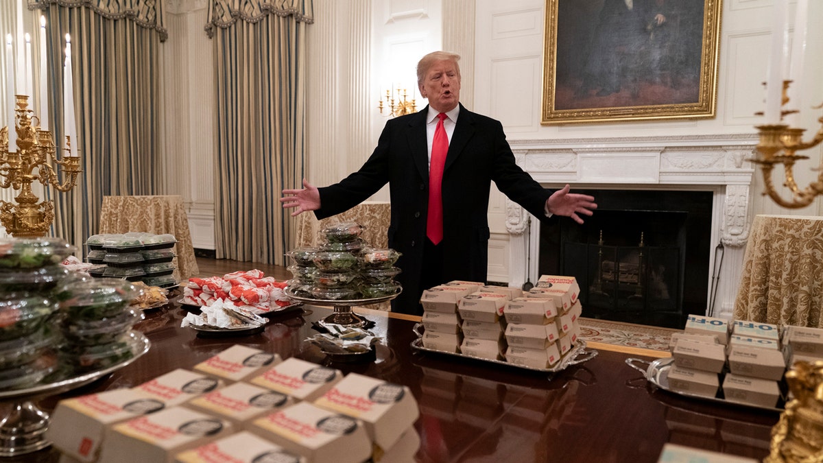 President Donald Trump serves fast food to the Clemson Tigers football team at the White House on Jan. 14, 2019, in Washington, D.C.