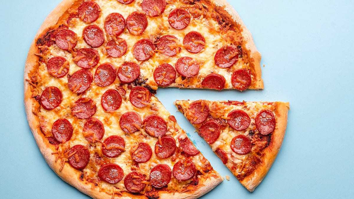 Top view of a pepperoni pizza. Homemade pizza.