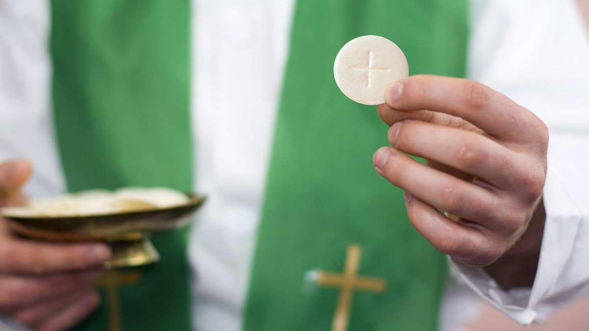 Studio shot composition, depicting Holy Communion.