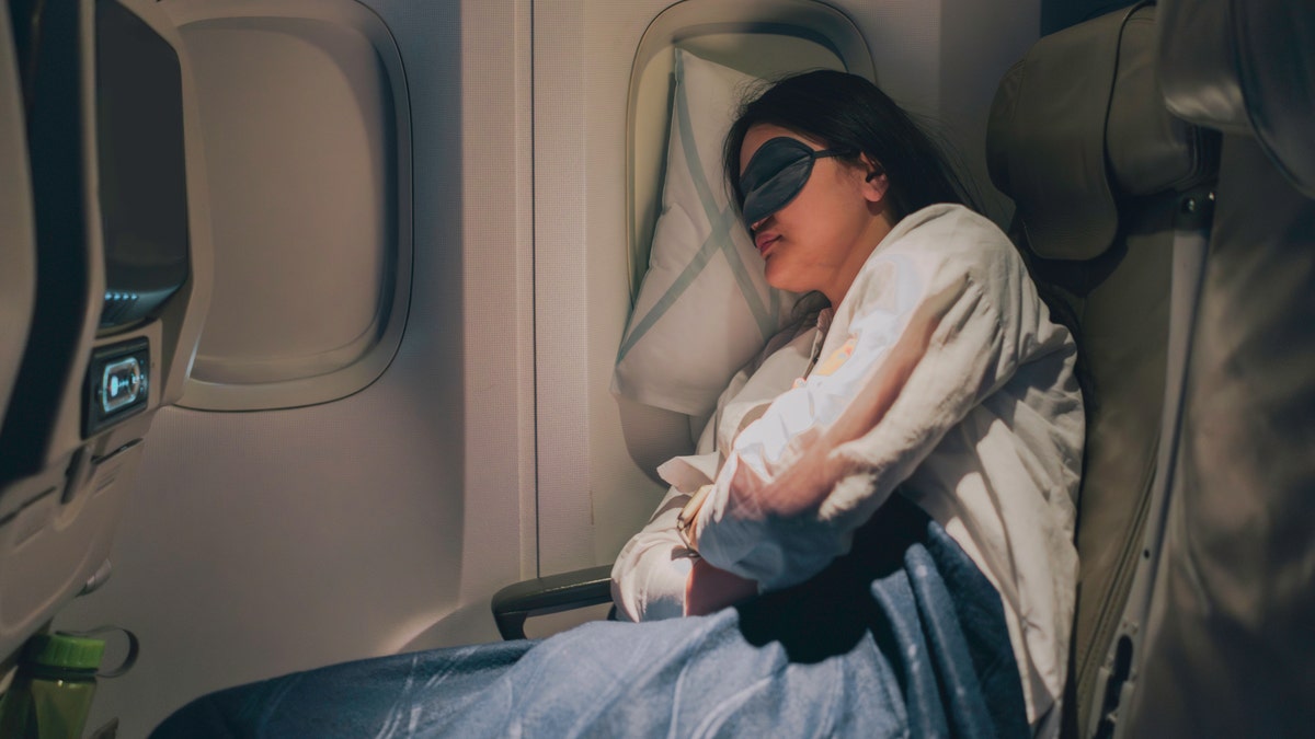 Woman sleeping on an airplane